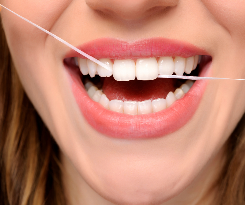 Why do we need to floss  regularly?